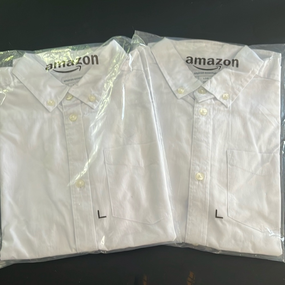 Two Amazon Essentials long sleeved white button down shirts